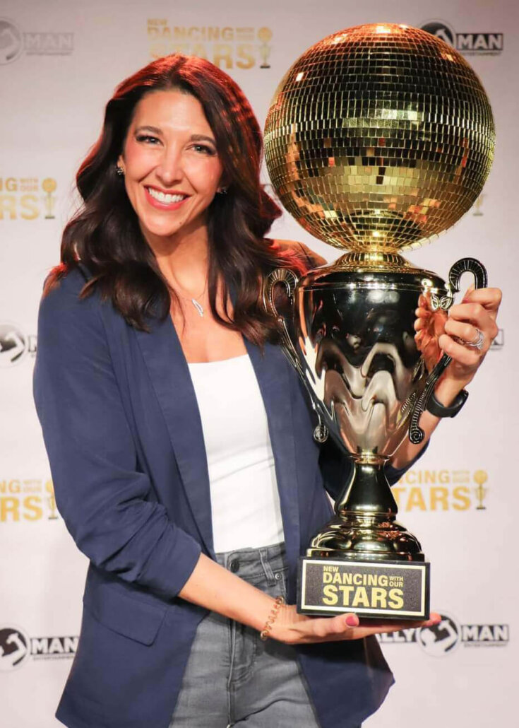 Melinda holding trophy